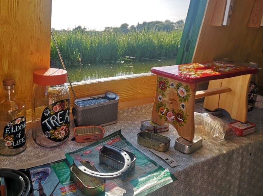 view of inside of a narrowboat painting bespoke horseshoes 